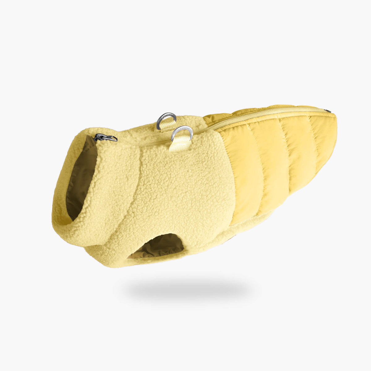 Angled view of a butter yellow sherpa puffer vest for dogs