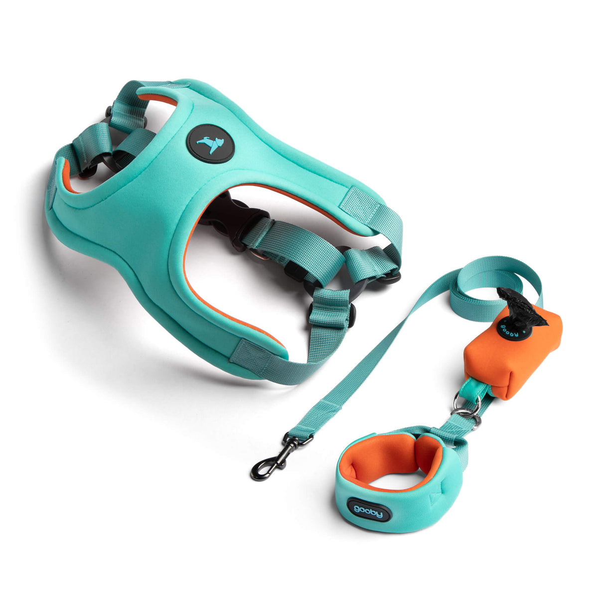 Sky blue pastel dog harness and matching leash set with orange accents on a white background