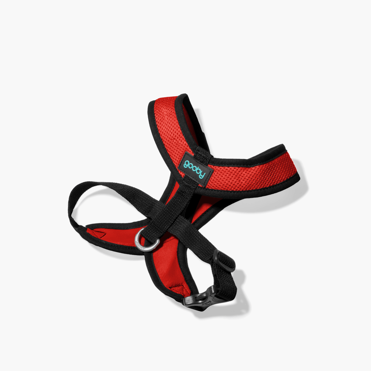 Red Comfort X harness on a white floor