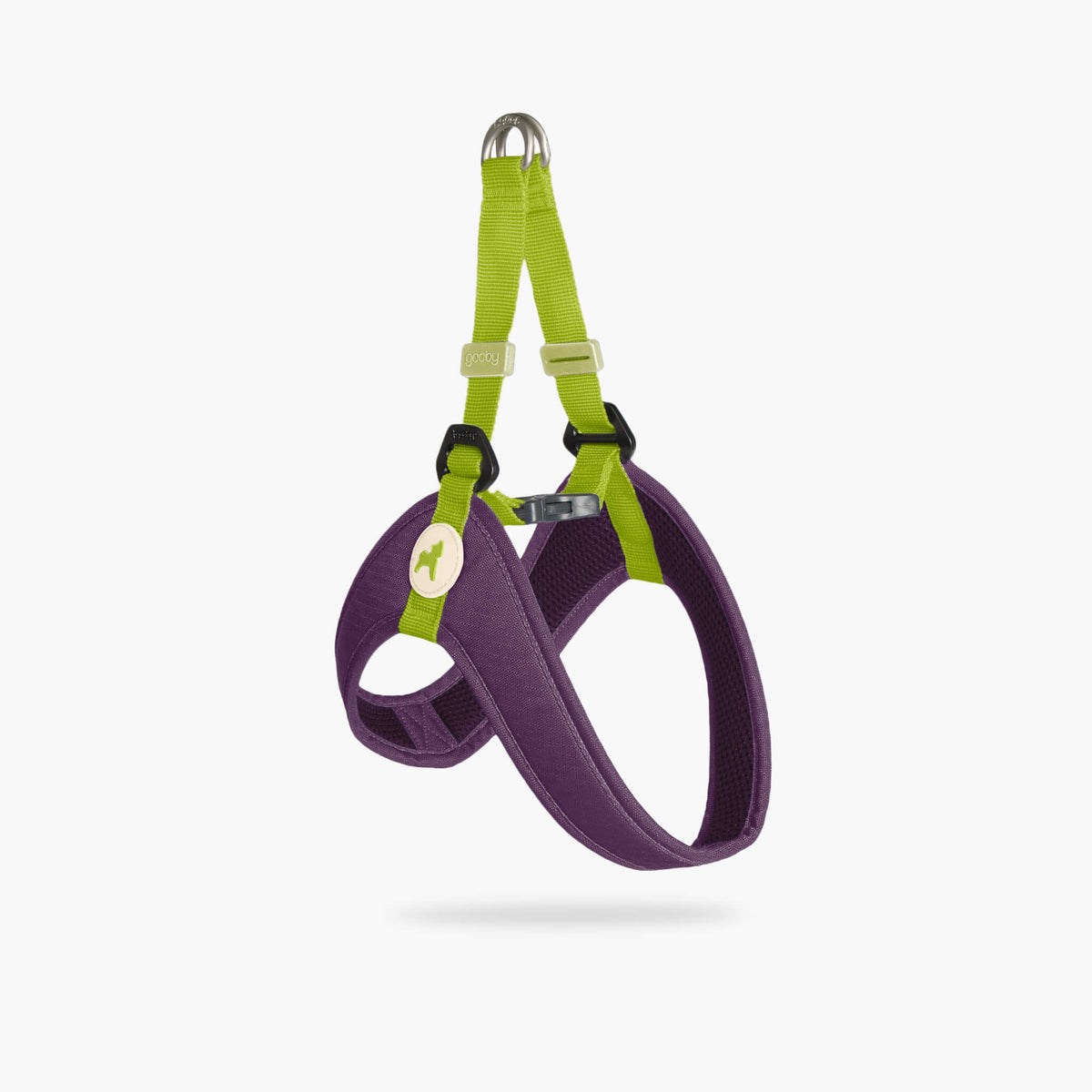 Purple step-in dog harness with bright green straps, shown at an angled view