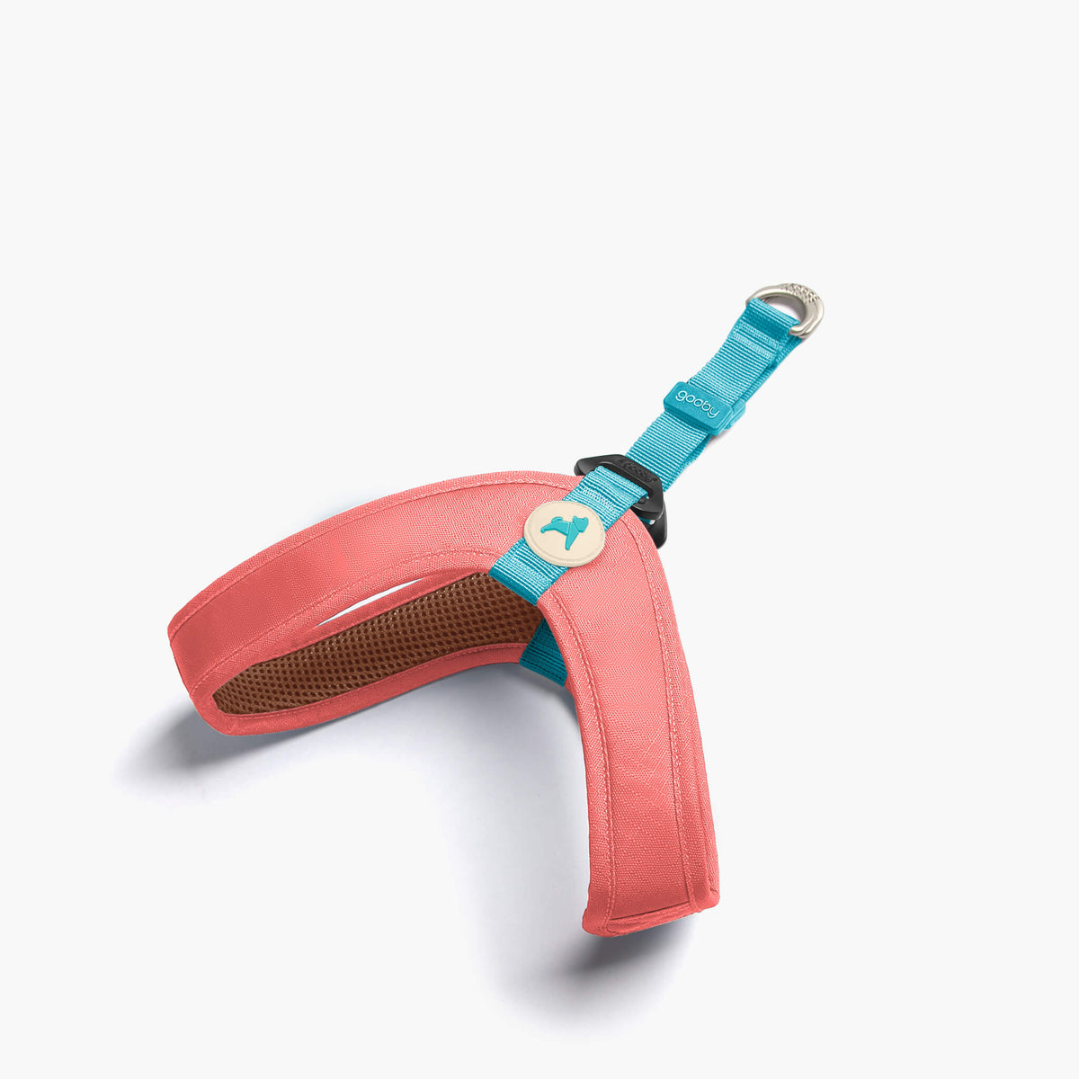 Solid pink step-in harness with a turquoise matching leash strap