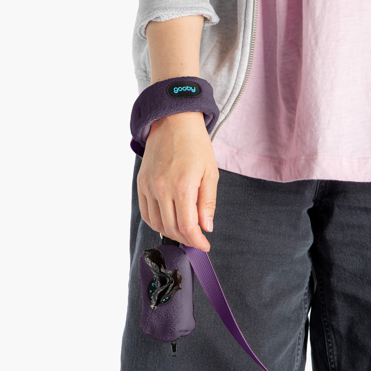 Person wearing a purple wristband leash with a matching purple attachment pouch