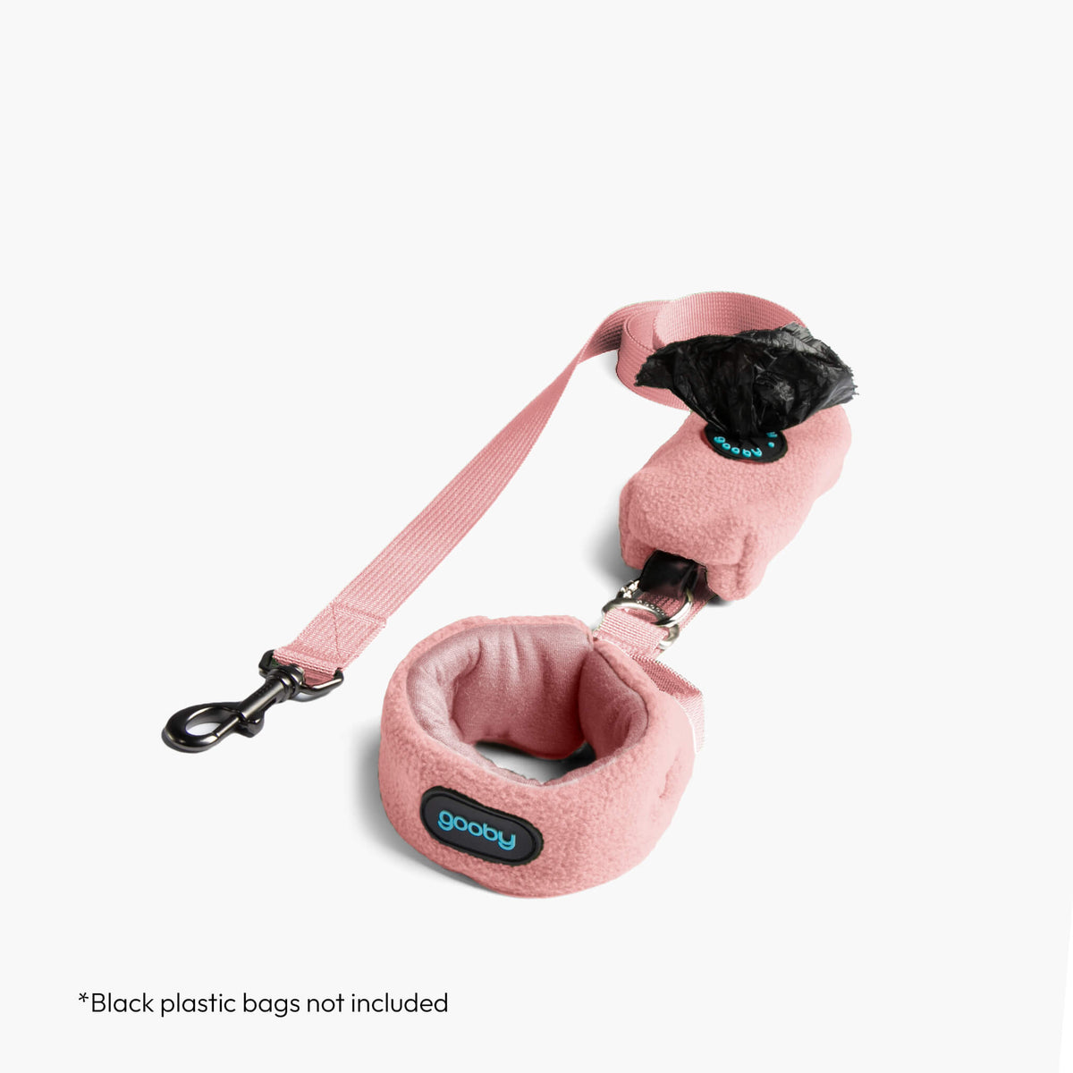 Pink fleece vest with matching leash arranged on a white background