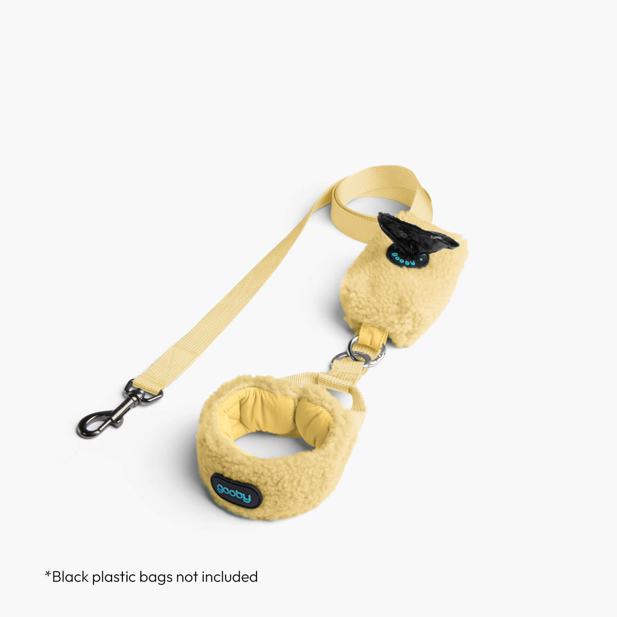 Butter Yellow sherpa puffer vest matching leash set; text reads “Black plastic bags not included.”