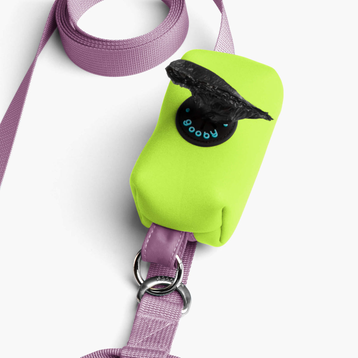 Close-up of a lavender dog leash with a neon green accessory pouch and metal attachment rings.