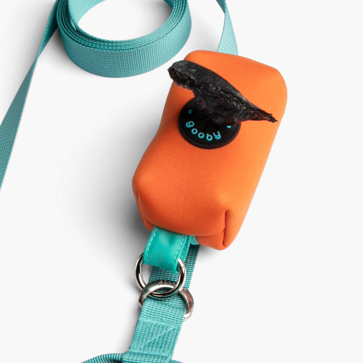 Close-up of a mint dog leash with an orange padded handle and metal attachment rings