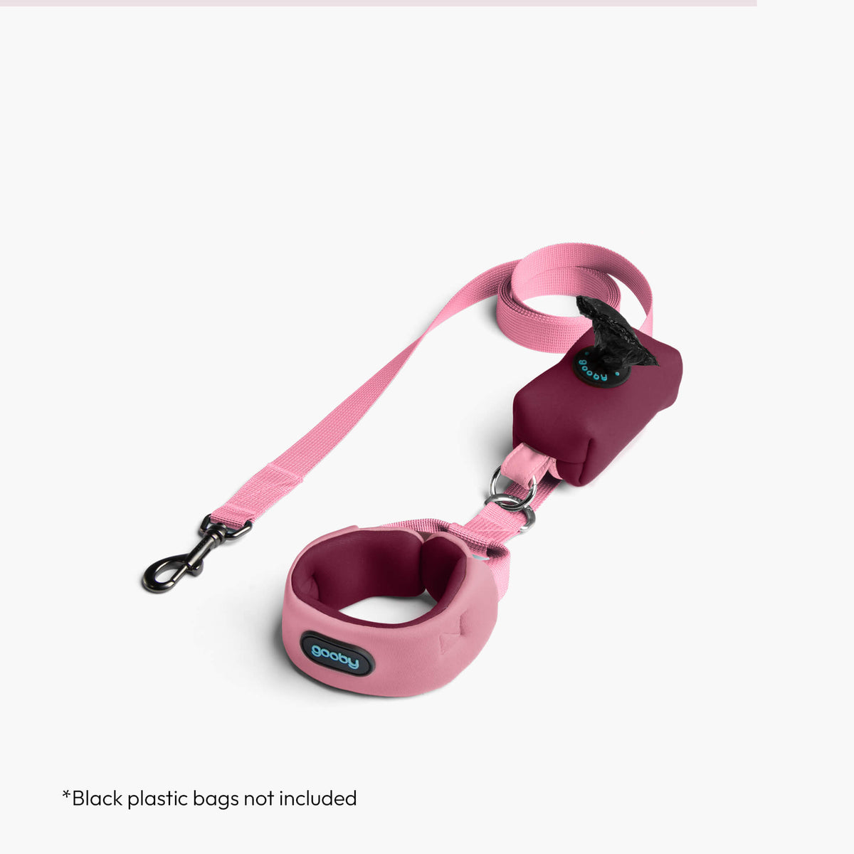 Baby pink Escape Free Sport harness with matching leash; black plastic bags not included.