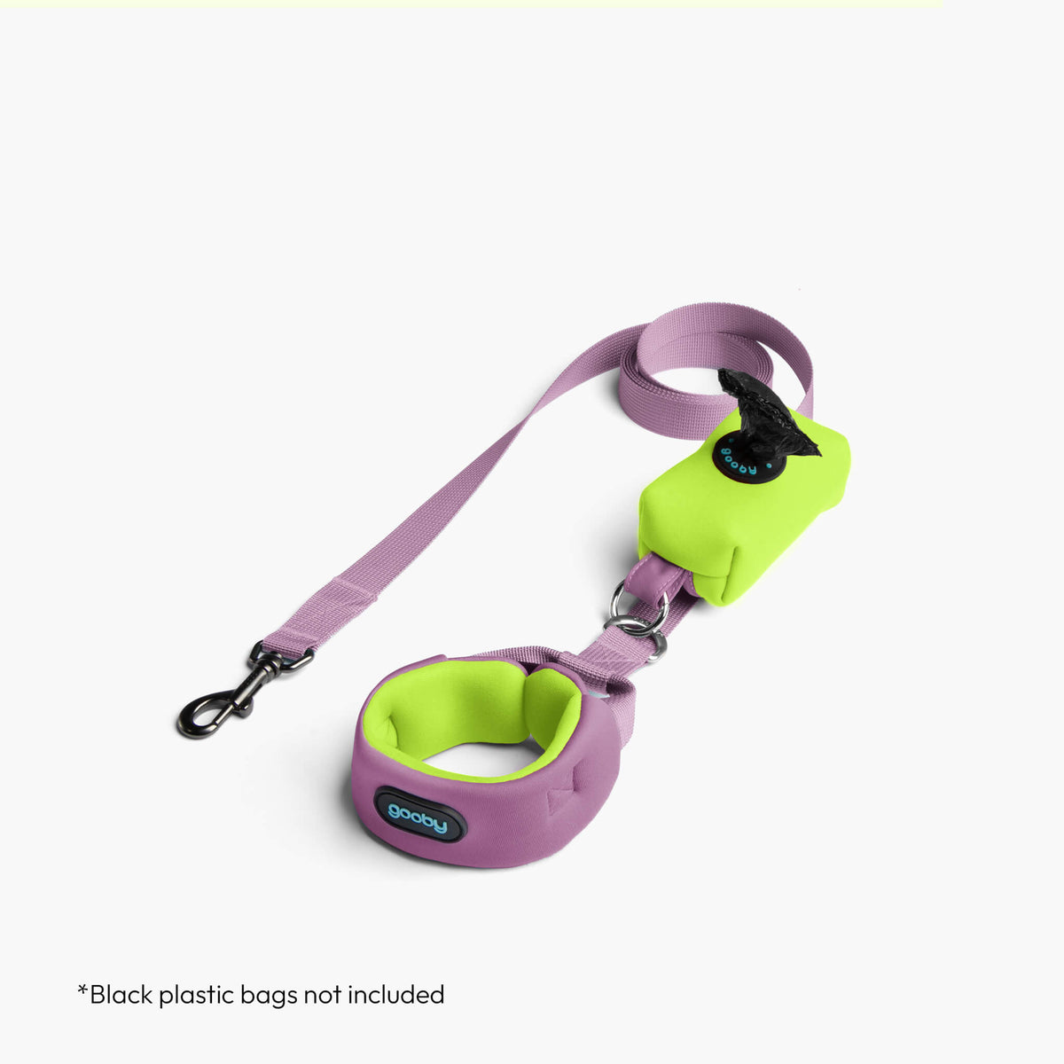Lavender harness and matching leash with bright lime accents on a white floor.