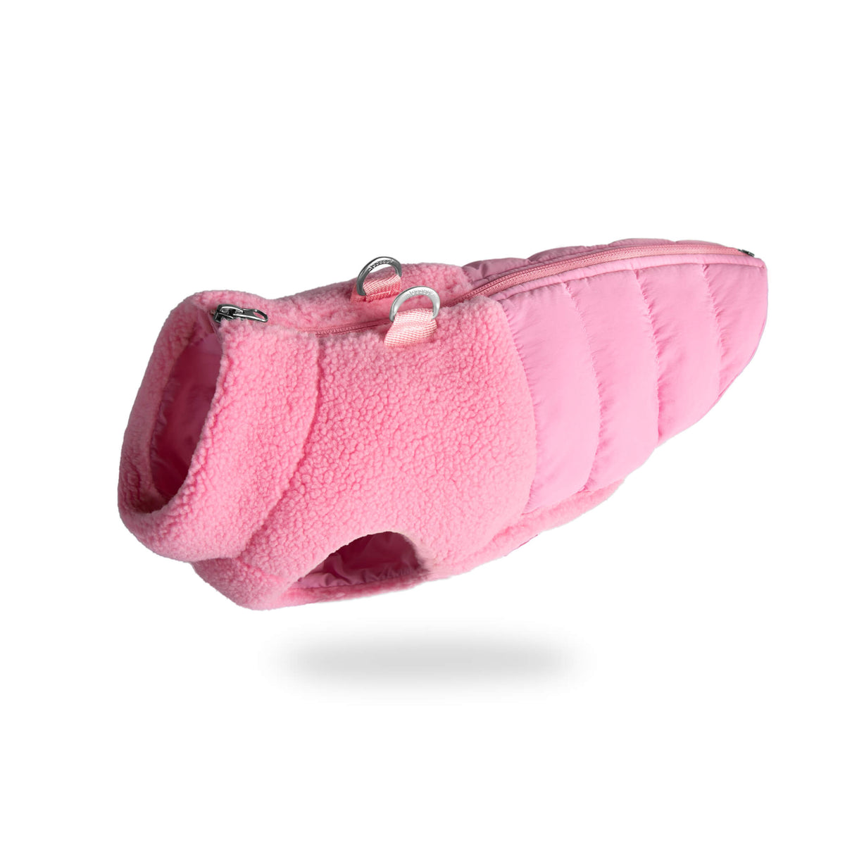 Baby pink sherpa-lined puffer vest for dogs, shown at an angle