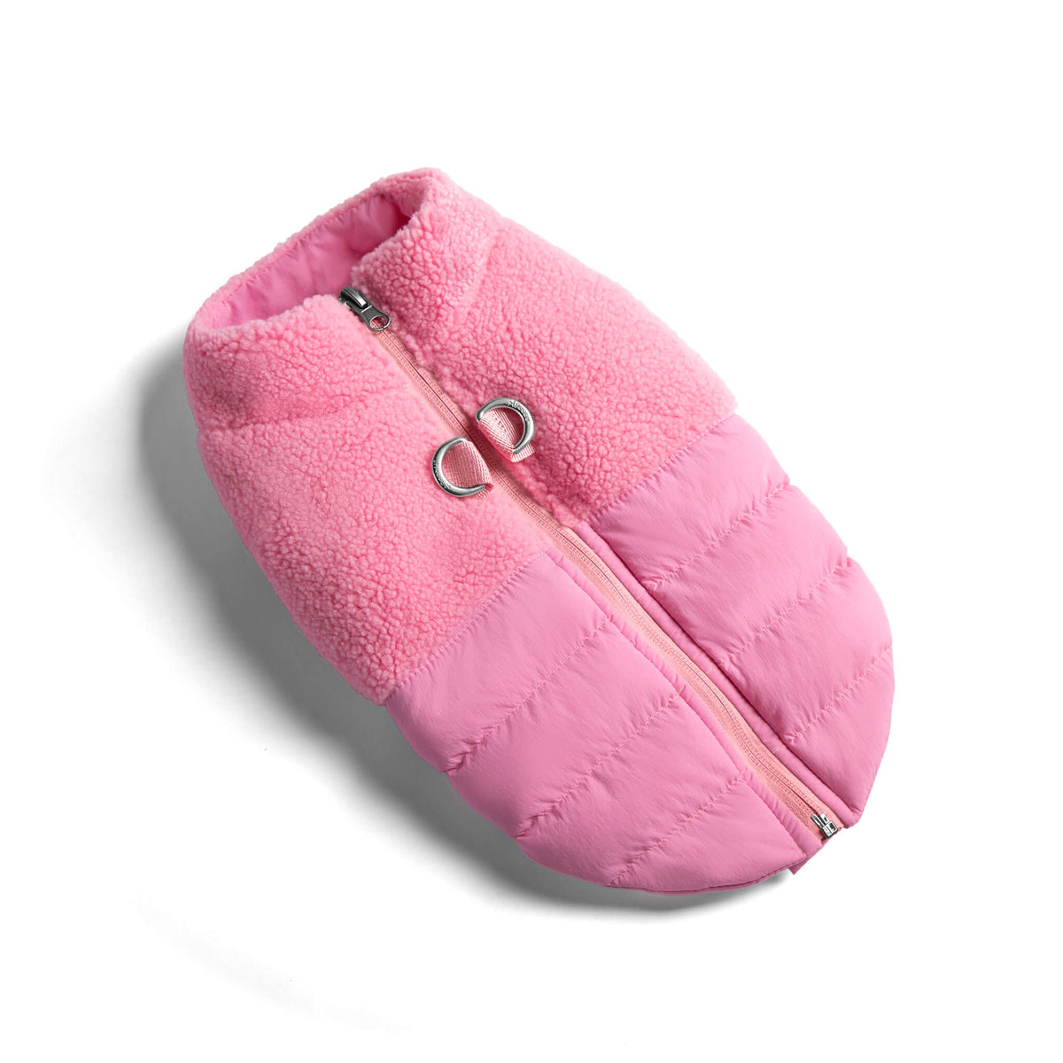 Baby pink sherpa puffer vest shown at an angle on a white background