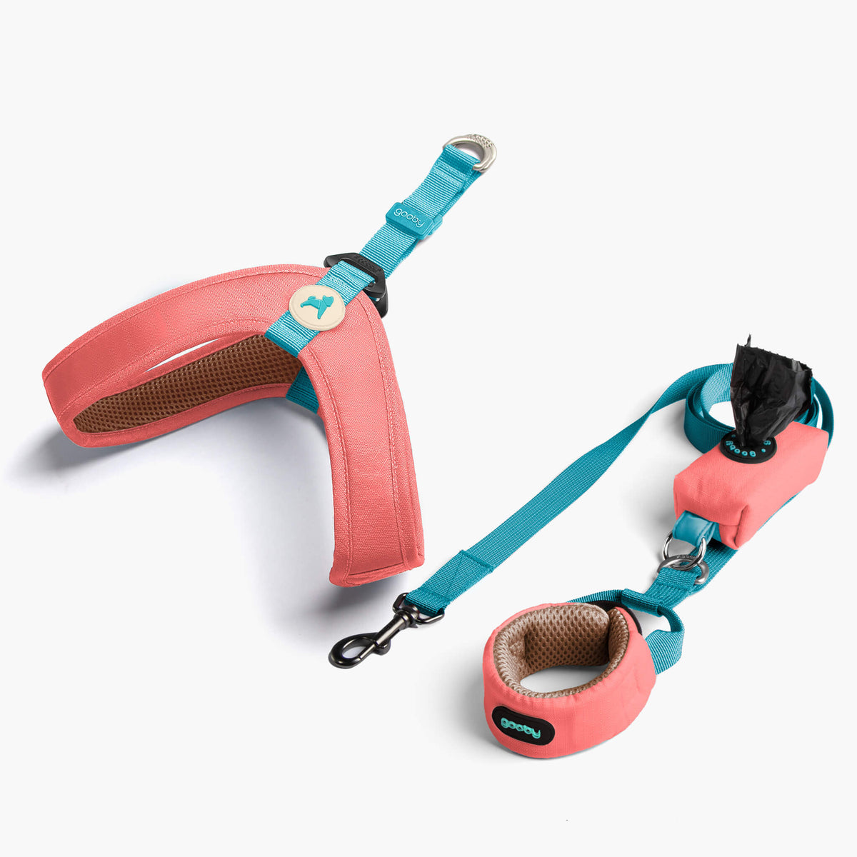 Solid pink step-in harness matching set with turquoise leash and hardware