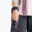 Close-up of a purple wristband leash and matching accessory pouch